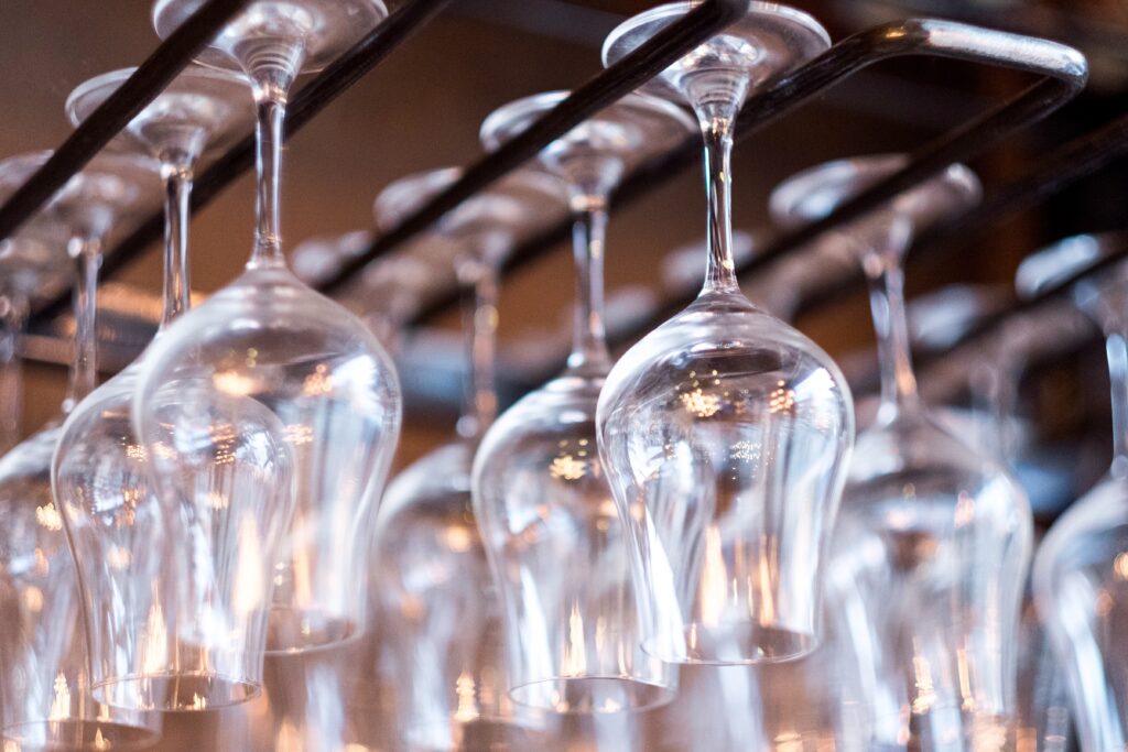 National Beer Day - Empty Glasses Above The Bar Rack - Chef's Deal
