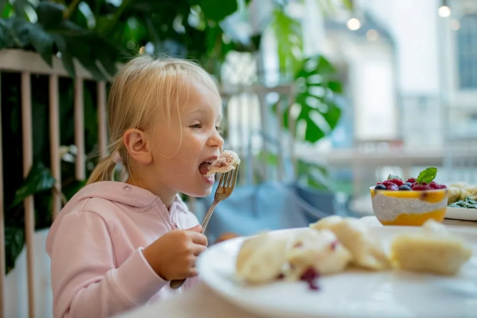 little girl eating dumpling, one of the popular street food - Chef's Deal