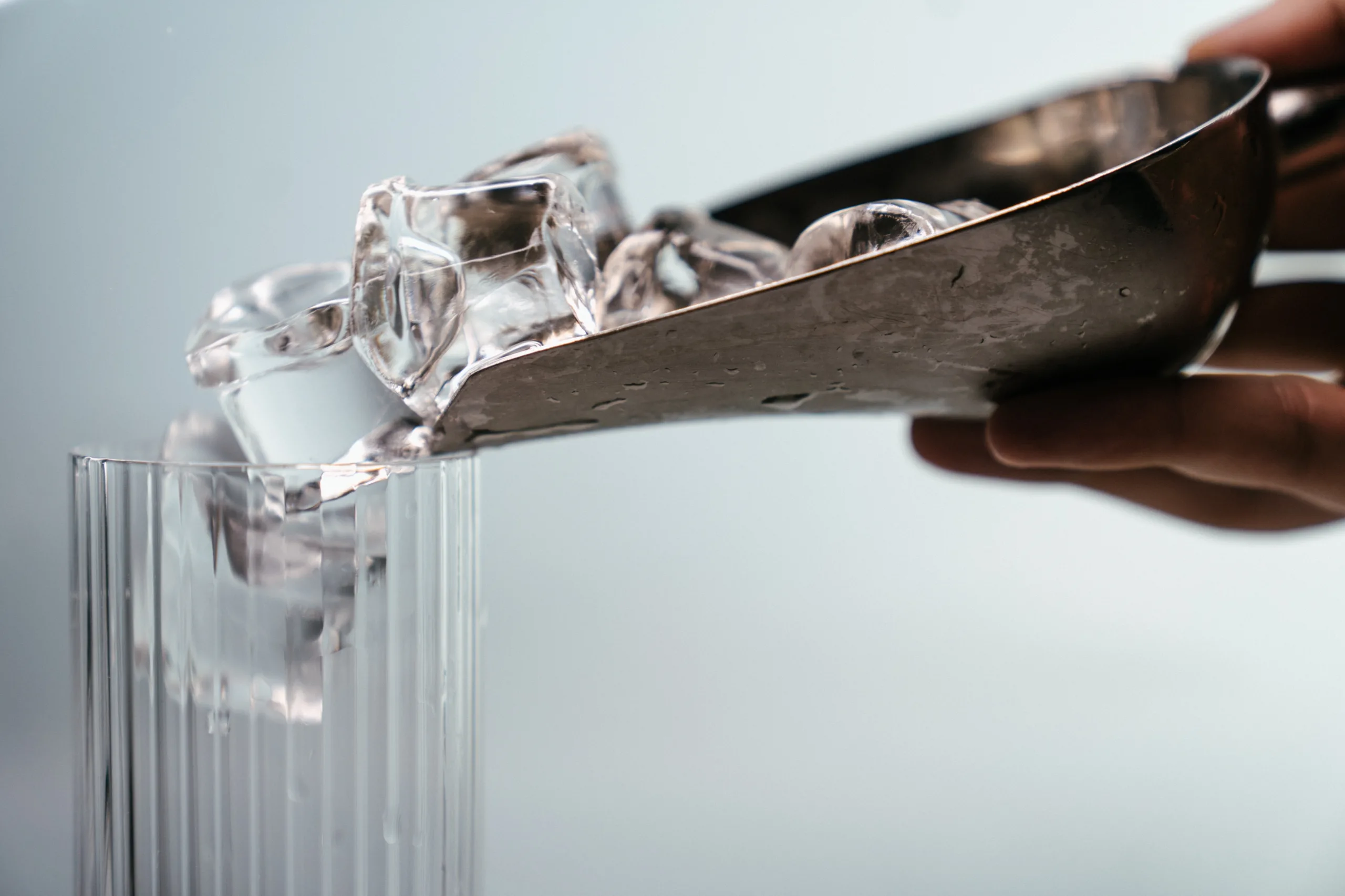 Ice Machine Cleaning and Maintenance- Ice Machine Cleaning and Maintenance in 15 Steps- ice being poured into a glass