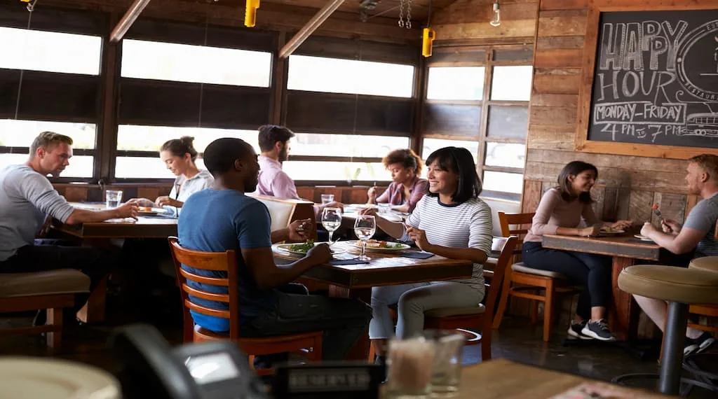 Couples are having lunch in a busy cozy restaurant